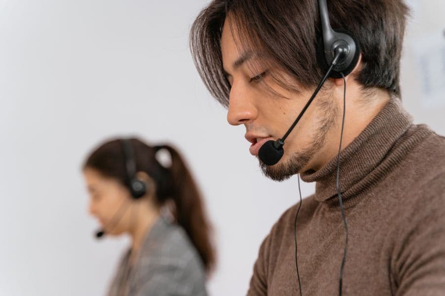 Customer service agent with a headset in a calm office