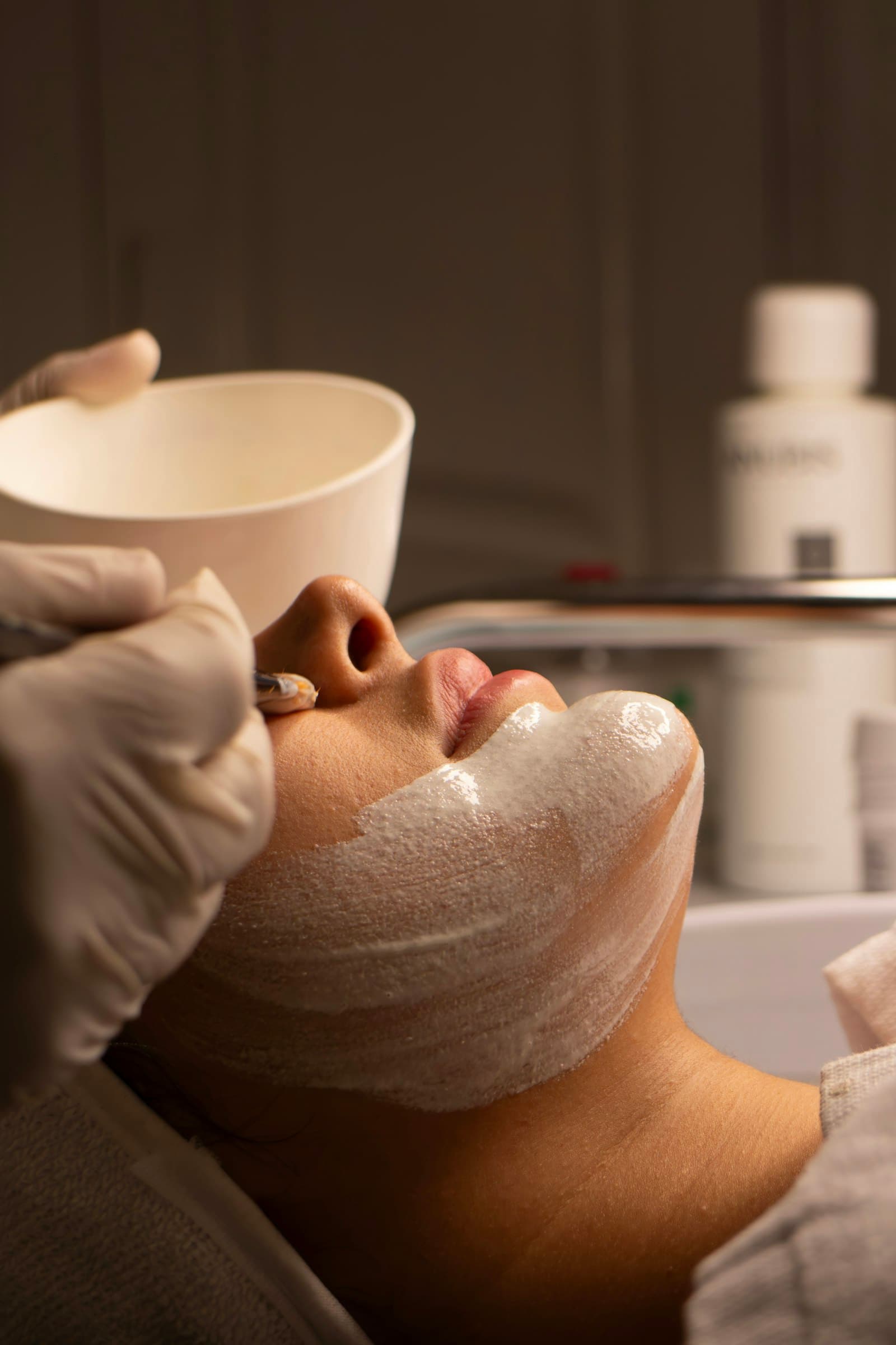 Beautician giving a facial treatment